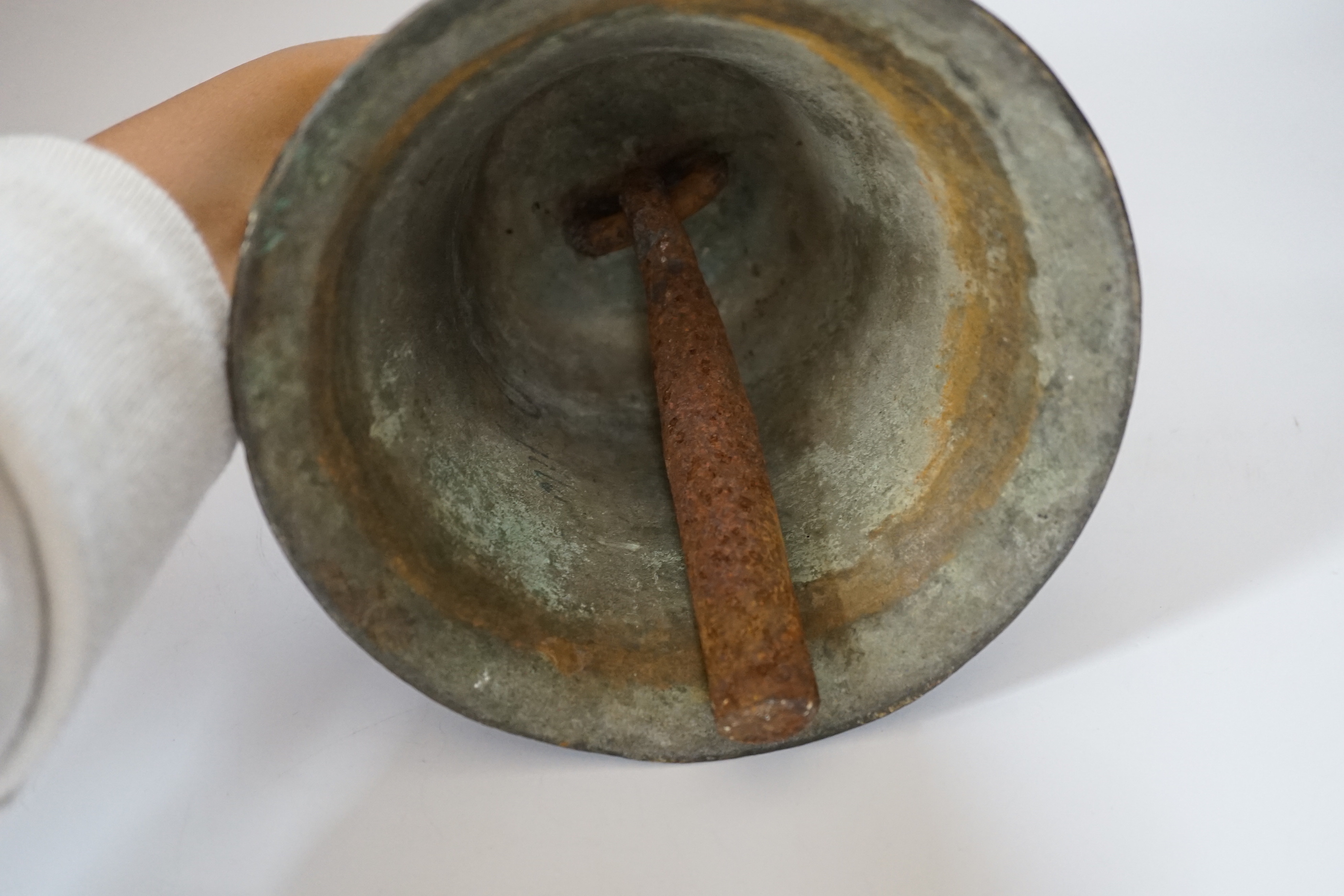 A bronze handbell with wooden handle, 31cm